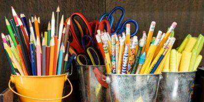 An image depicting several types of common classroom donation requests, including pencils, scissors, pens, and more.